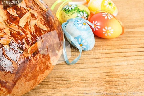 Image of Typical homemade Easter Cake With Almonds and painted eggs
