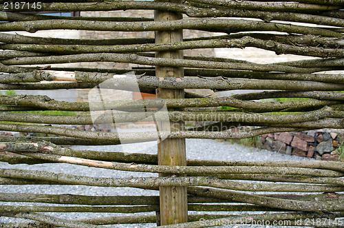 Image of closeup wicker weave wooden twig fence background 