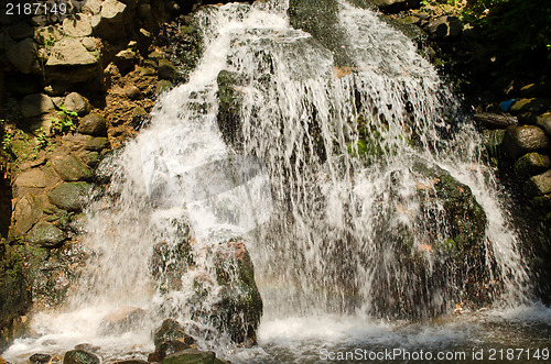 Image of powerful waterfall in summer 