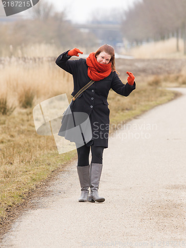 Image of Woman dressed in warm clothing