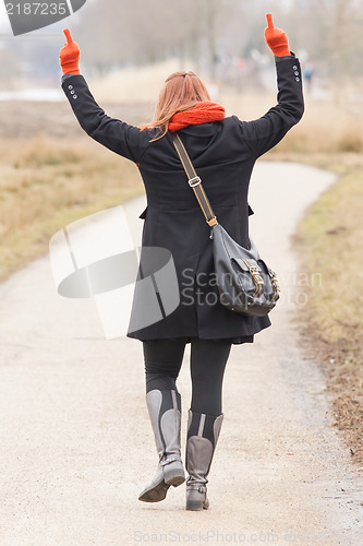 Image of Woman dressed in warm clothing