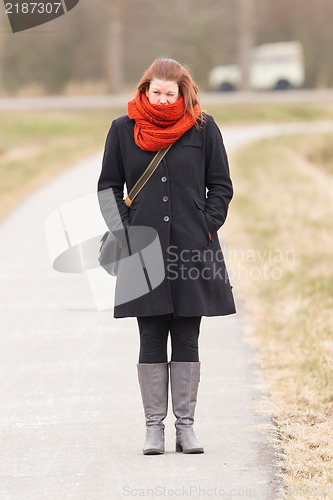 Image of Woman dressed in warm clothing