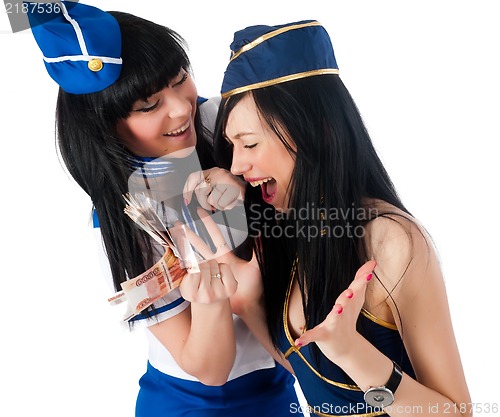 Image of Two pretty stewardess with money