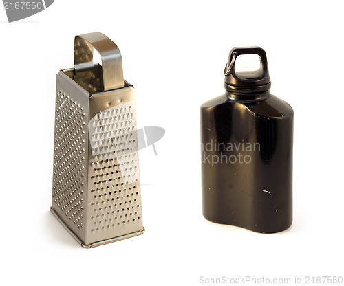 Image of metal cheese grater and flask, black water  canteen isolated on white backgroundcloth