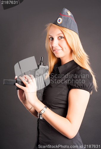 Image of Pretty woman with a gun