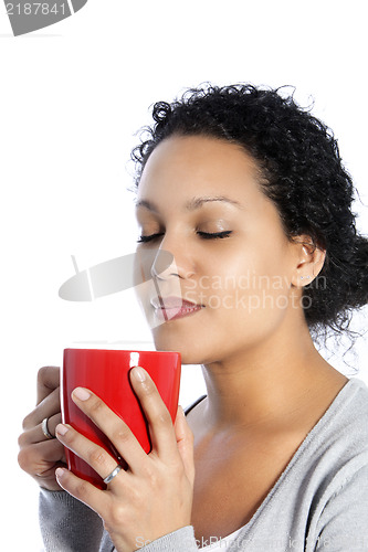 Image of Woman enjoying a mug of coffee