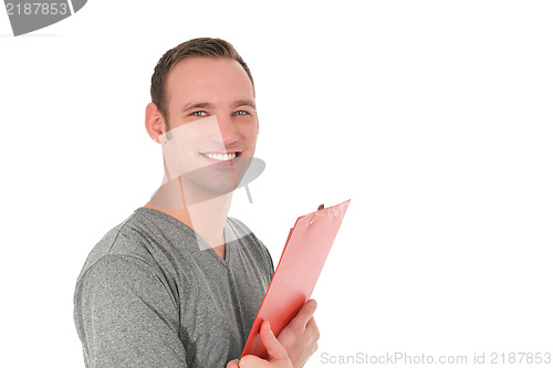 Image of Handsome smiling man holding a clipboard