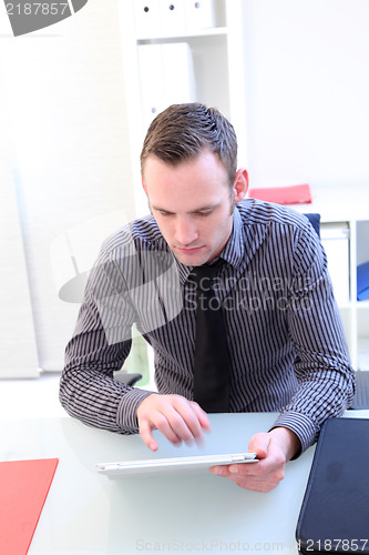 Image of Businessman using a tablet