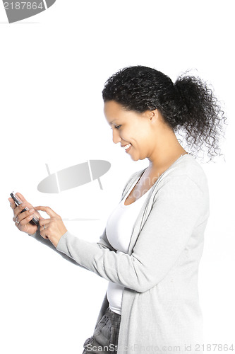 Image of Smiling woman sending an SMS