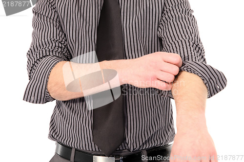 Image of Man rolling up his shirt sleeves