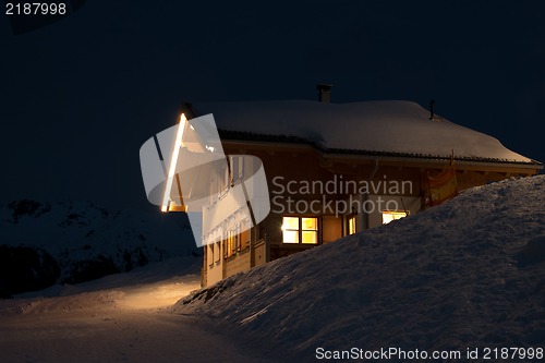 Image of Beautiful skiing hut at  night