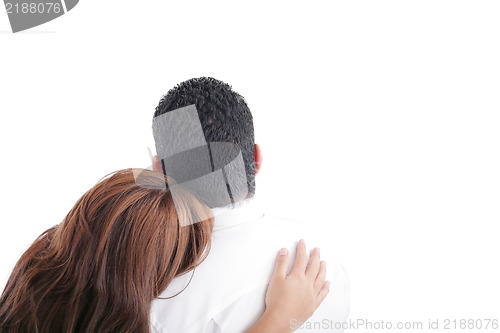 Image of Back view of young embracing couple look into distance. 