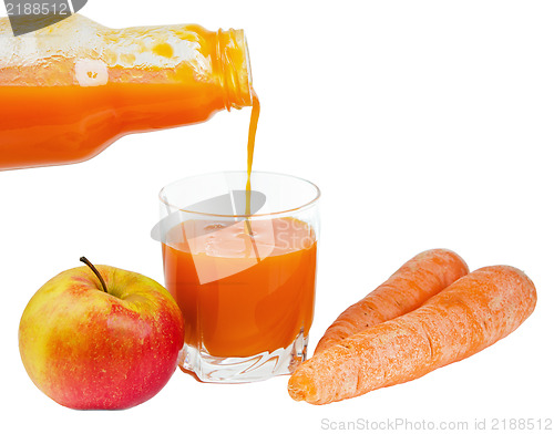 Image of Bottle with carrots juice and an apple