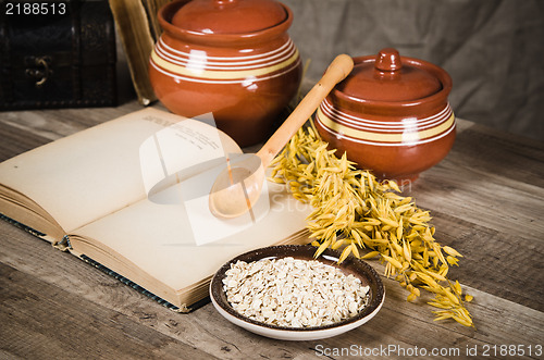 Image of  Still life with oatmeal and an open book