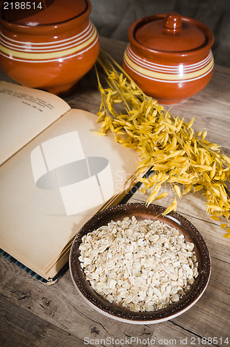 Image of  Still life with oatmeal and an open book