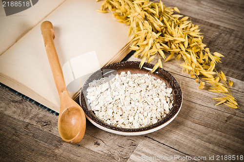 Image of  Still life with oatmeal and an open book