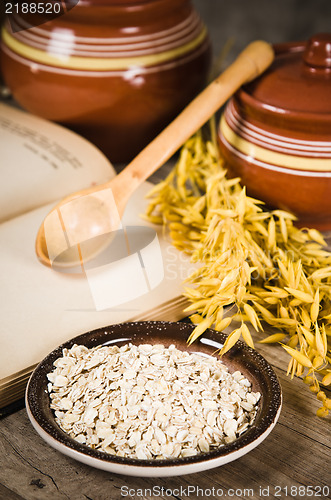 Image of  Still life with oatmeal and an open book