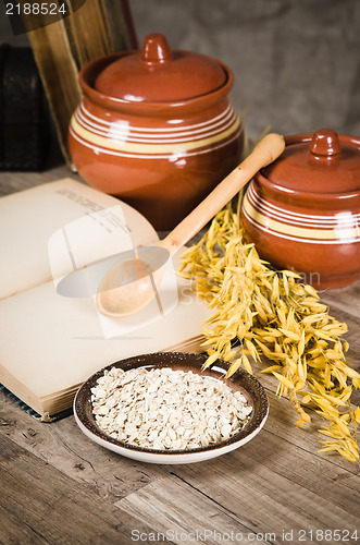 Image of  Still life with oatmeal and an open book
