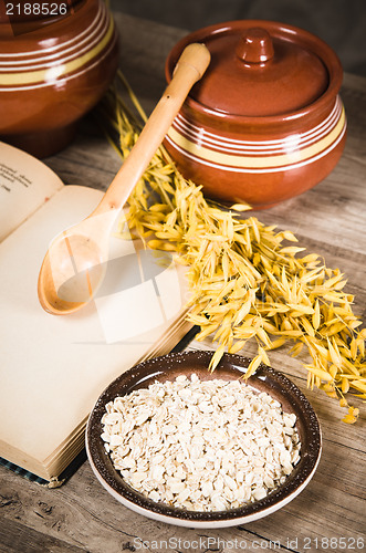 Image of  Still life with oatmeal and an open book