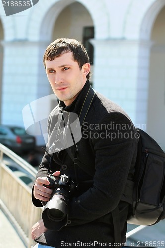 Image of Young photographer with camera