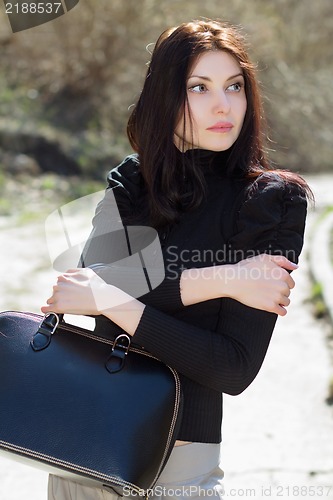 Image of Brunette with bag
