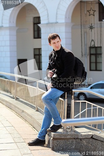 Image of Young man with camera