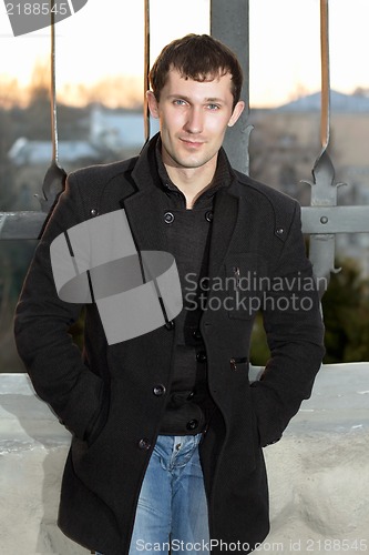 Image of Young man in coat