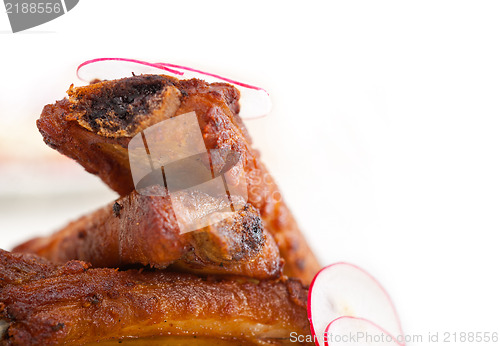 Image of pork ribbs on polenta corn cream bed