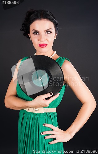 Image of Pretty girl holding vinyl disc