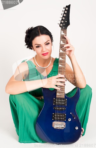 Image of Pretty woman with guitar