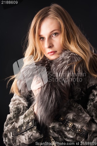 Image of attractive woman in fur coat