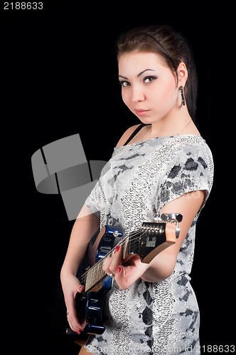 Image of Pretty woman with guitar