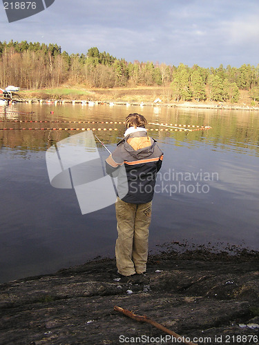 Image of boy fishing