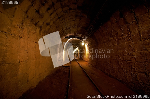 Image of Underground mine passage with rails