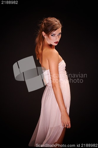 Image of Young woman against dark background