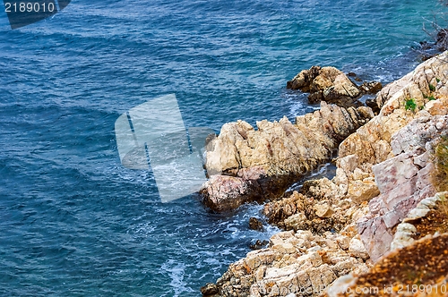 Image of Shore of an ocean with big rocks