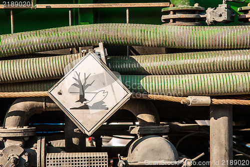 Image of Toxic waste car with danger sign