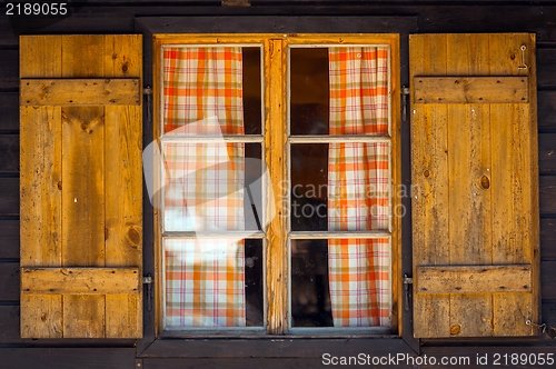 Image of Small wooden cottage with window