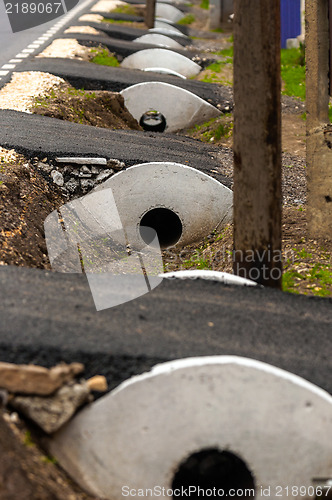 Image of Sewage pipes under small road