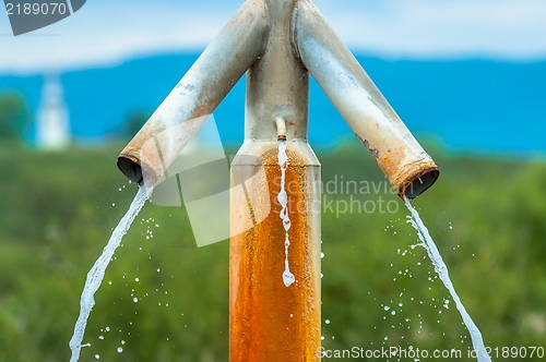 Image of Water flowing from outdoor tap
