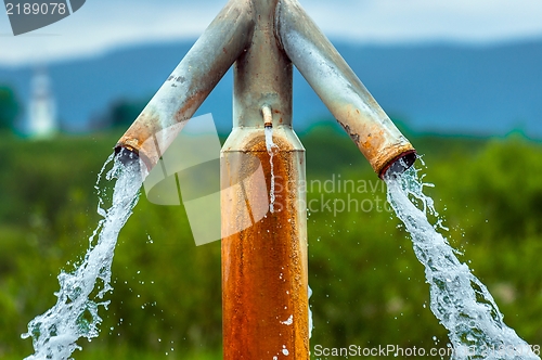 Image of Water flowing from outdoor tap