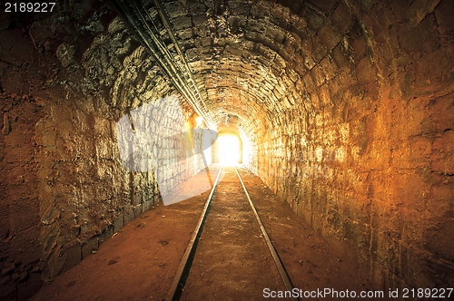Image of Underground mine passage with rails