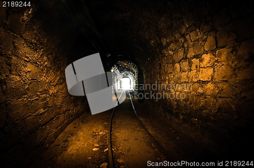 Image of Underground mine passage with rails
