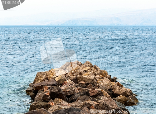Image of Shore of an ocean with big rocks