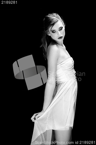 Image of Young woman against dark background