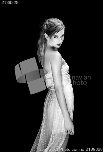 Image of Young woman against dark background