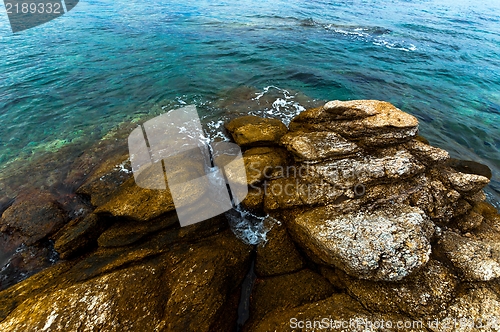 Image of Shore of an ocean with big rocks