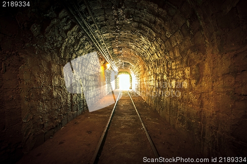 Image of Underground mine passage with rails