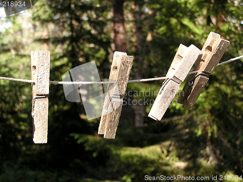 Image of 4 old clothes pegs