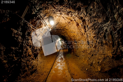 Image of Underground mine passage with rails